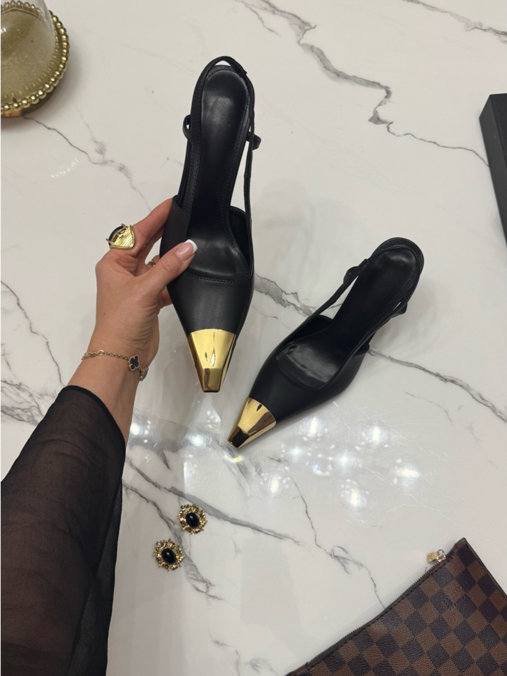 like Yves Saint Laurent Black Slingback Pumps with Gold Toe Accent